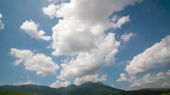 time lapse clouds over the mountain blue sky background