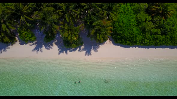 Aerial view abstract of perfect island beach vacation by aqua blue lagoon with white sand background