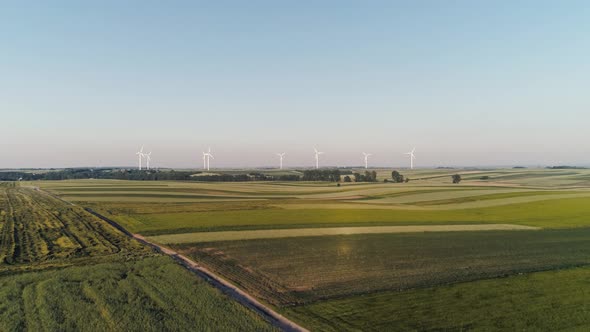 Drone view of wind turbines on the agricultural field