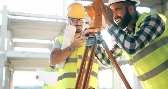 Portrait of Construction Engineers Working on Building Site