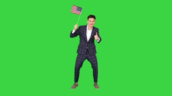 Young Man in Formal Suit Dancing in a Funny Way with American Flag on a Green Screen, Chroma Key
