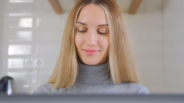 Entrepreneur blonde woman using laptop computer for online work from home on lockdown in 4k video