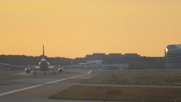 Airplane Landing at the Early Morning