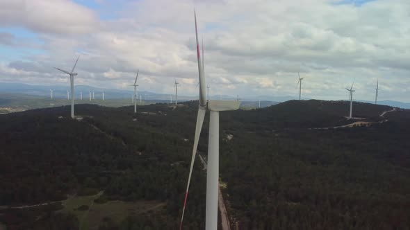 Aerial View Over the Farm Landscape and Wind Turbines Generating Clean Renewable Energy