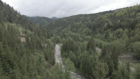 Ukraine, Carpathian Mountains: River in the Mountains. Aerial. Gray, Flat