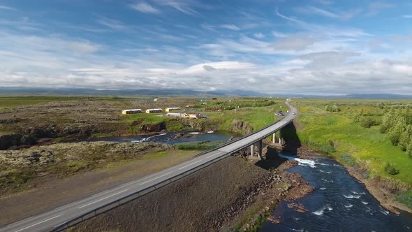 Flying above the bridge over the river on the ringroad in Iceland