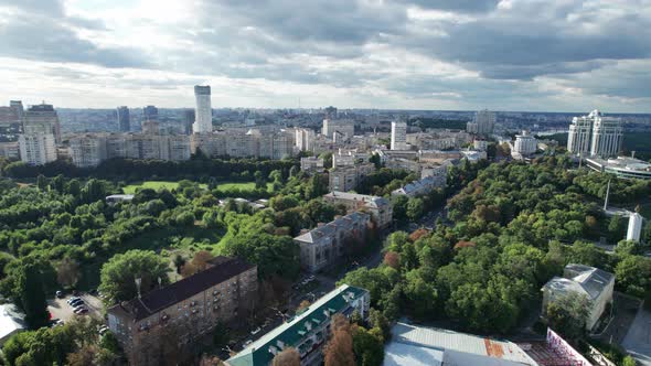 Aerial View of Metropolis City Skyline with Skyscrapers Green Trees and Sky