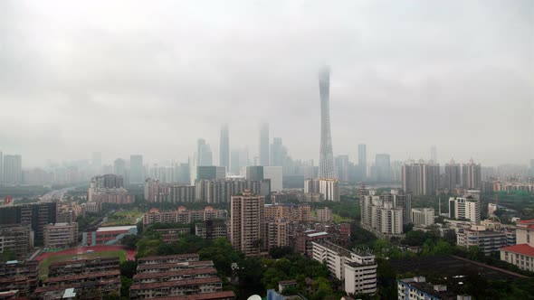 Guangzhou Skyscraper Tops in Clouds in China Timelapse