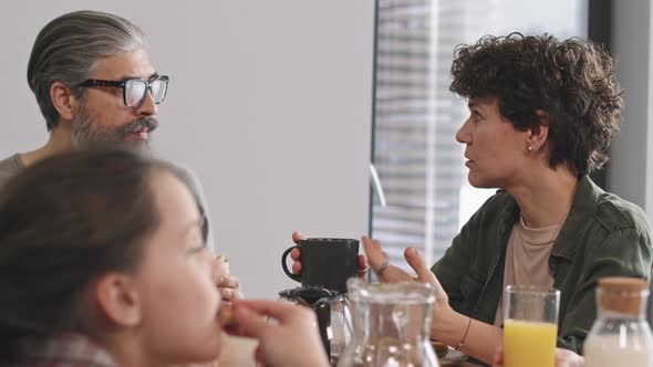 Senior Man Talking To Grown Up Daughter