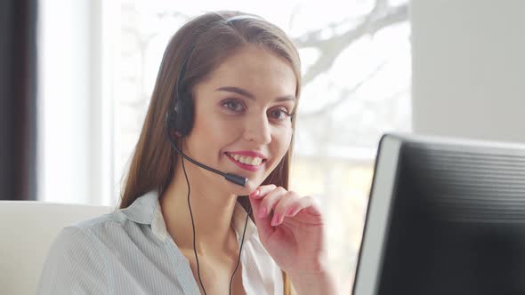 Young Woman Works at Home Office Using Computer.