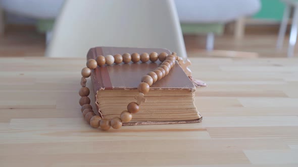 Rosary Lying on Holy Bible