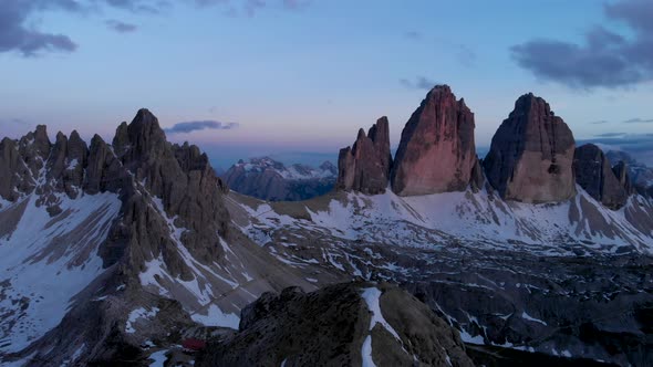 Drone Flying Near Tre Cime di Lavaredo Mountain Italy Dolomites at Sunset