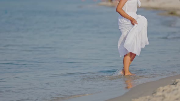 a Woman Walks Barefoot on the Sea