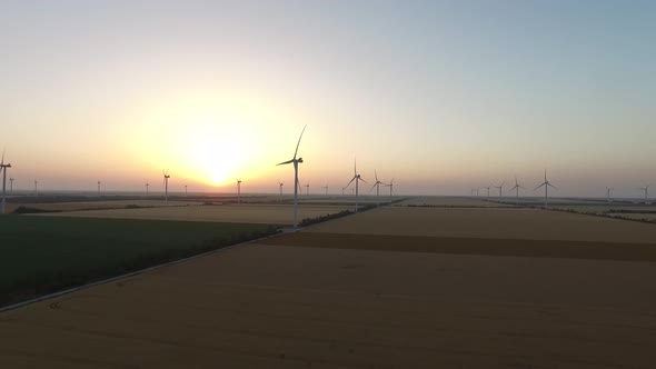 Wind Pinwheels Renewable Sources of Wind Energy in the Beautiful Landscape at Sunset. Aerial Survey