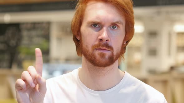 Portrait of Redhead Beard Man Waving Finger to Refuse No