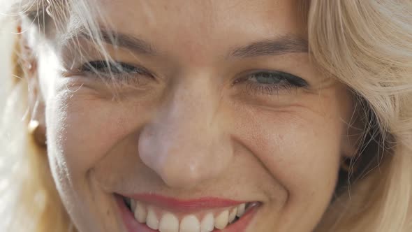 Cropped Shot of a Beautiful Happy Woman Laughing To the Camera