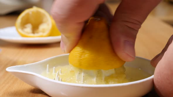 Hand Squeezeing Lemon Fruit