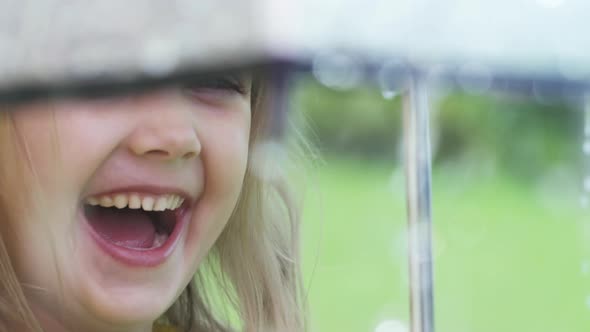 Girl Laughing during Rain