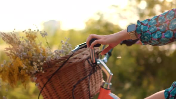 Girl In Hat Enjoying Weekend. Woman Cyclist Walking With Bike On Holiday Vacation Trip. Wildflower.