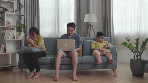 Asian Dad With Children Obsessed With Devices Overuse Social Media, Internet Addiction Concept