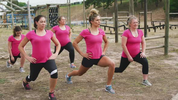 Female friends enjoying exercising at boot camp together