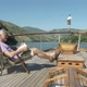 Senior man reading book on a boat - VideoHive Item for Sale