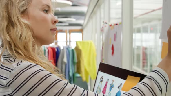 Young woman working in a fashion studio