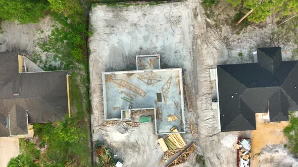 Aerial View of Incompleted Frame of Private Home Under Construction with Brick Concrete Walls Ready