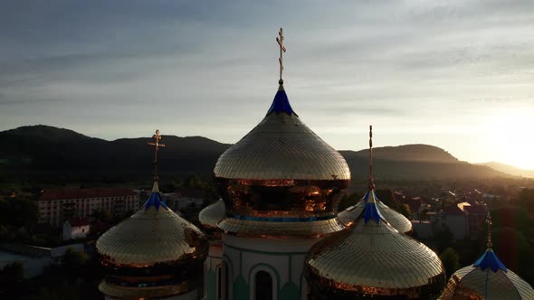 Golden Church Cross on Against Sunset Aerial View Majestic Temple in Ukraine