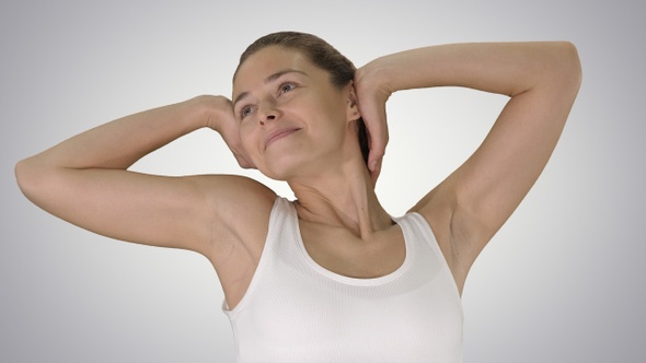 Contented Happy Young Woman Stretching Her Arms While Walking