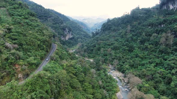 Traveling by Van Through the Foggy Jungle