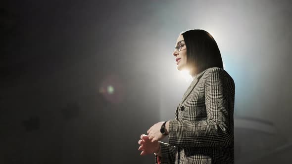 Expert Perform on the Stage Address To Modern Crowd Audience Sitting and Listening in Large Hall