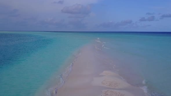 Drone view travel of shore beach by blue lagoon with sand background