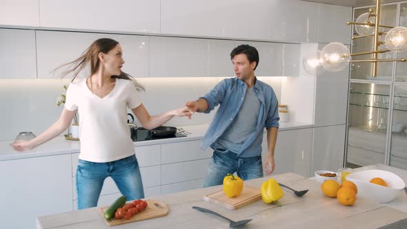 Cute Couple Dancing in the Kitchen