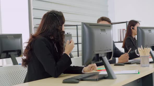 Business People Wearing Headset Working in Office