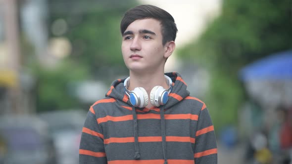 Young Handsome Iranian Teenage Boy in the Streets Outdoors