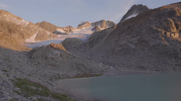 Panoramic View of Vibrant Colorful Glacier Lake Up in Rocky Mountains