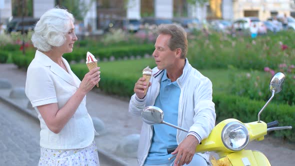 Mature Couple Eats Ice Cream.