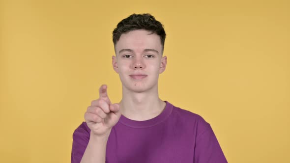 Young Man Inviting Friends on Yellow Background