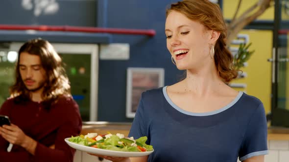 Waitress holding a plate of of salad 4K 4k