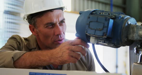 Worker using machine