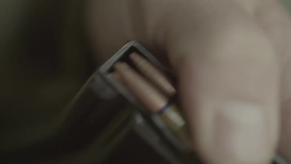 Cartridges Charge. Close-up. Slow Motion