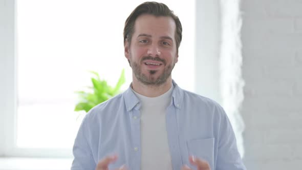 Portrait of Young Man Talking on Online Video Call