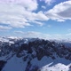Aerial drone view of difficult access mountain peak for climbers during a winter sunny day - VideoHive Item for Sale