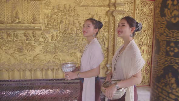 Women In Lao Traditional Costume Walking In Temple