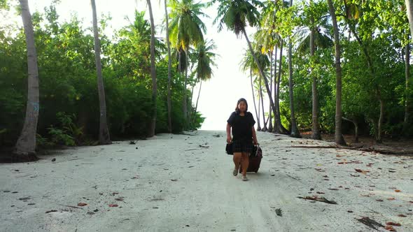 One girl tans on tropical lagoon beach time by shallow ocean and white sand background of the Maldiv