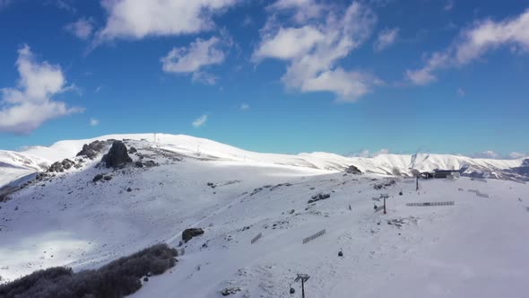 Aerial view at the mountain on a sunny winter day