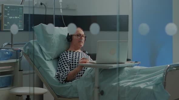 Hospital Ward Patient Listening to Music in Intensive Care