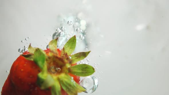 Strawberry Drop Down Into Water