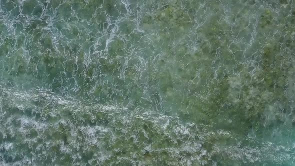 Aerial drone landscape of shore beach by blue ocean and sand background